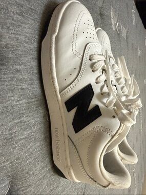 New Balance White Leather Sneakers with Black 'N' Accent